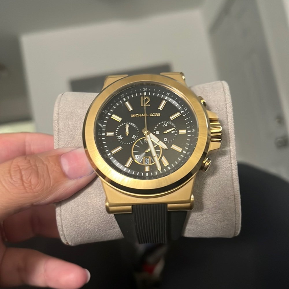 Black and gold Michael Kors watch.